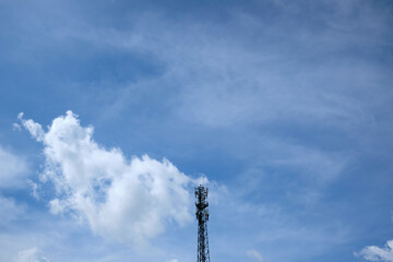 Telecommunication tower on blue sky background. High technology communication satellite communications and communication concept. Mobile cellular telephone on pole.