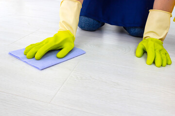 The concept of cleaning service. Cleaning floor using rag. General or regular cleanup. Commercial cleaning company.