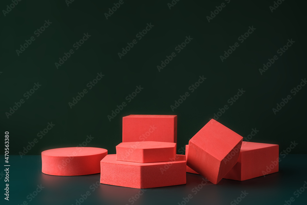 Poster Group of red block display block on dark green background