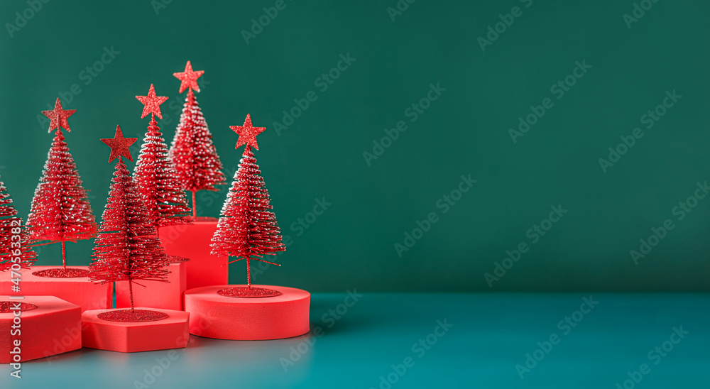 Poster christmas tree red color with star pine tree group on green background with space