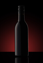 a small bottle of wine on a black background