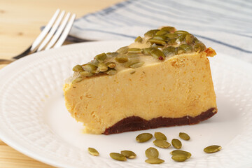 Slice of cheesecake with nuts on plate