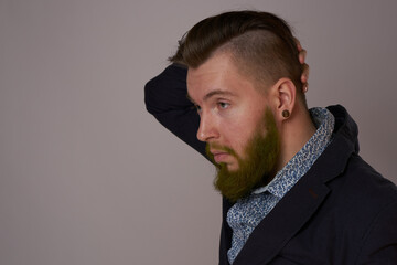 handsome bearded man in jacket fashion posing close-up