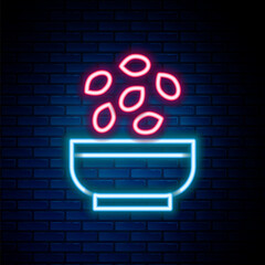 Glowing neon line Seeds in bowl icon isolated on brick wall background. Colorful outline concept. Vector