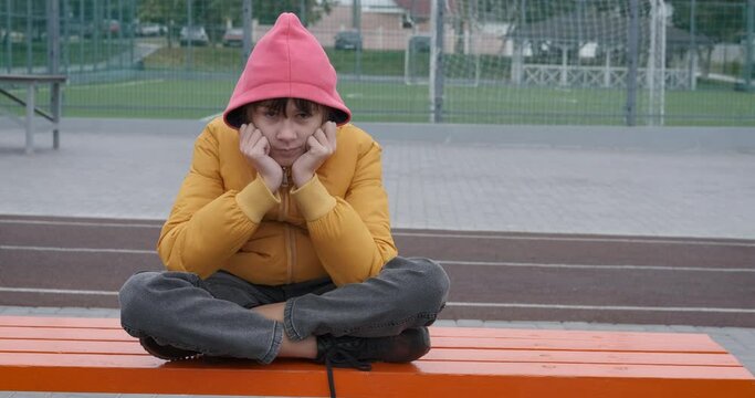 Girl thinking of life troubles. A teenager with life trouble feel the depression inside outdoor.