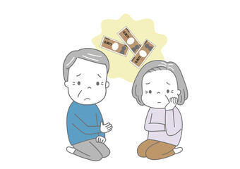 お金のことについて困った顔で話し合う高齢夫婦