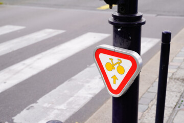 cyclist in town traffic sign authorization to go straight on an intersection