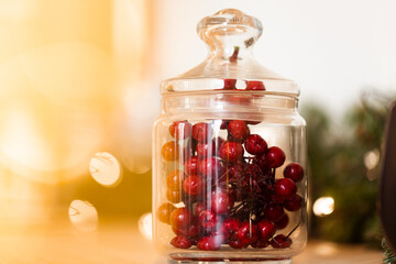 Glass jar with viburnum berries close up