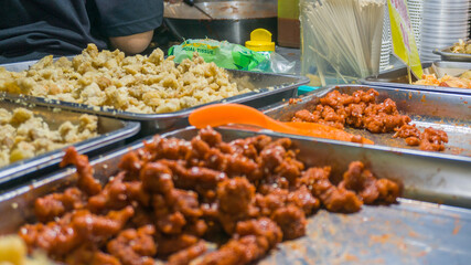 Spicy fried chicken pop and chicken skin at the street food stall