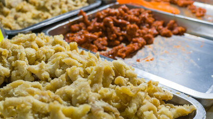 Spicy fried chicken pop and chicken skin at the street food stall