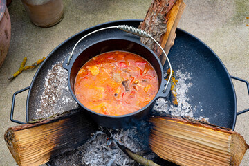 Kettle goulash is prepared over an open fire!