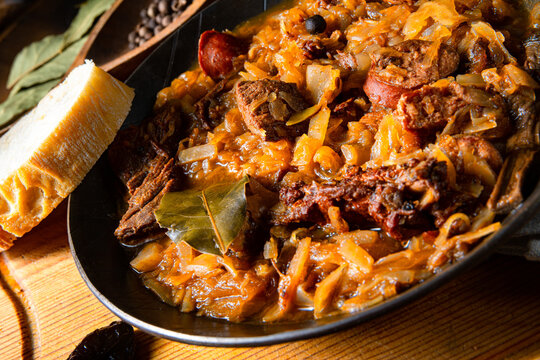 Polish bigos cooked according to an old recipe with wine and plum