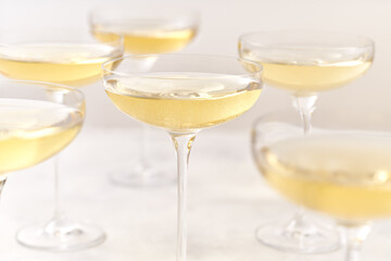 glasses of sparkling champagne on a white background, selective focus.