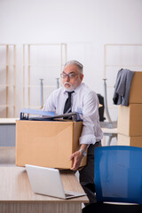 Old male employee in relocation concept