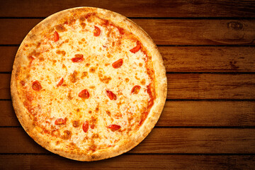 Pizza Margherita top view. Pizza margarita mozzarella cheese on wooden background for pizzeria banner. Flat lay