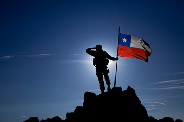 Silhouette of an unrecognizable soldier with the Chilean flag