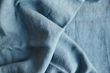 Fototapeta premium Linen fabric with pleats blue color texture
