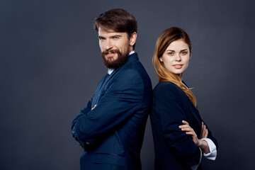 cheerful business man and woman are standing next to team work