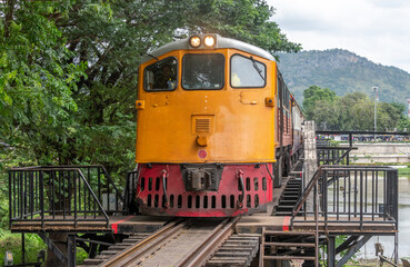 Obraz premium Train crossing the historic bridge over the River Kwai at Kanchanaburi Thailand on the old Burma Railway