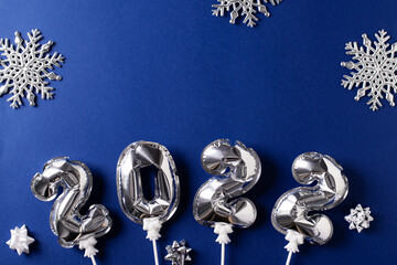 New year ccard flat lay with silver number balloon