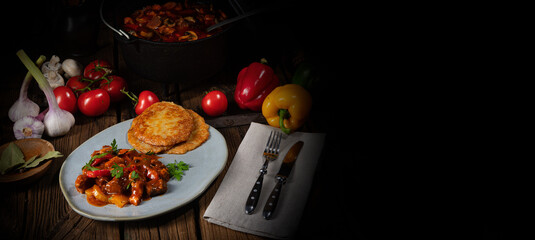 Original Hungarian goulash with potato pancakes