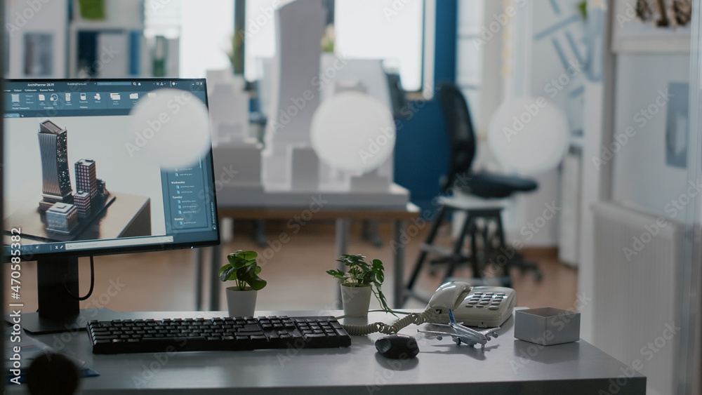 Poster empty architectural workplace with building model and 3d construction layout on table. nobody in off