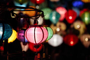 Fototapeta na wymiar Light papers in Night market in Vietnam colour background