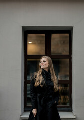 Fototapeta premium smiling woman wearing black coat
