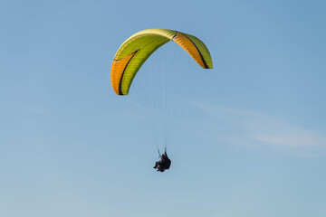 Twin paraglider. Paragliding against the blue sky.