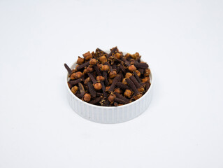 Dried cloves on white background. Biriyani making ingredient.