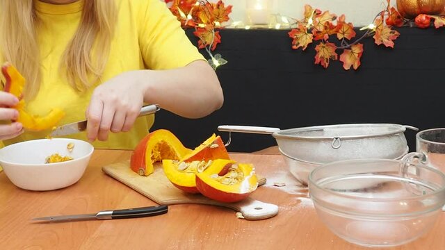 Mam And Daughter Are Making Dough pie For Thanksgiving Pie. put the dough in a mold for a thanksgiving pumpkin pie. Process of making Pumpkin pie for Thanksgiving Day. Seasonal traditional autumn fest