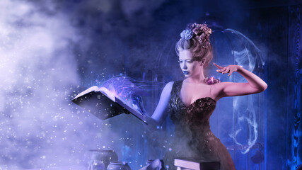 Christmas fairy tale concept. Snow queen calling winter use book of spells