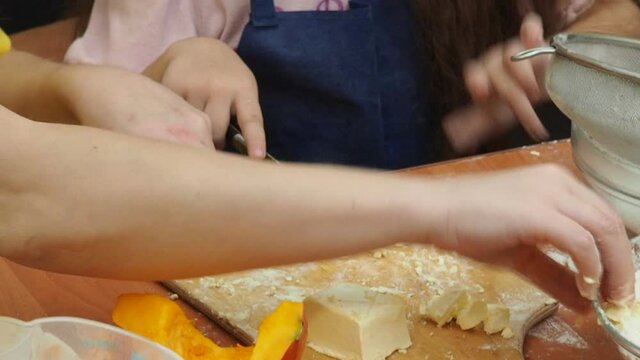 Mam And Daughter Are Making Dough pie For Thanksgiving Pie. put the dough in a mold for a thanksgiving pumpkin pie. Process of making Pumpkin pie for Thanksgiving Day. Seasonal traditional autumn fest