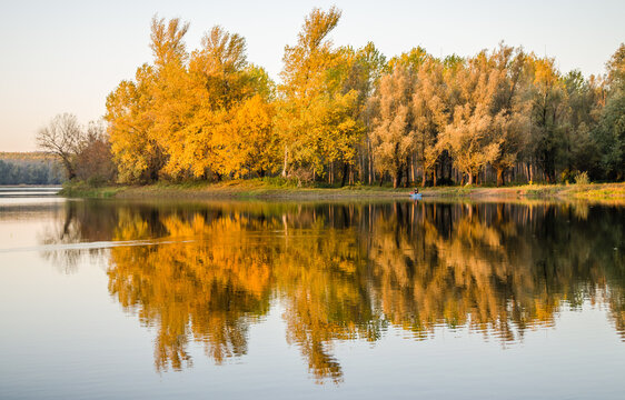 Begec, Serbia - October 30. 2021: Autumn panorama on the artificial lake Begecka jama, near the city of Novi Sad. © caocao191