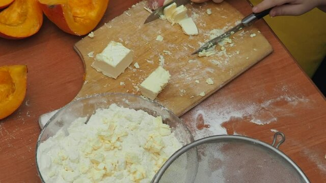 Mam And Daughter Are Making Dough pie For Thanksgiving Pie. put the dough in a mold for a thanksgiving pumpkin pie. Process of making Pumpkin pie for Thanksgiving Day. Seasonal traditional autumn fest