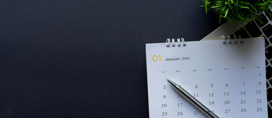 close up top view on white calendar 2022 month schedule to make appointment meeting or manage...