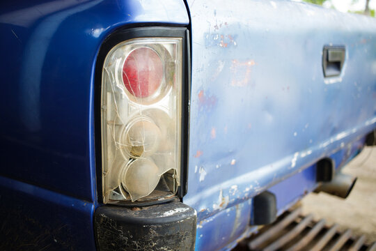 broken car tail light on blue picuptrack.car eccident.