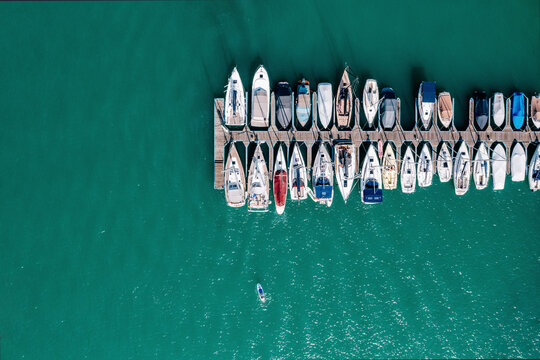 Aerial view of motorboats moored along jetty on Worthersee lake