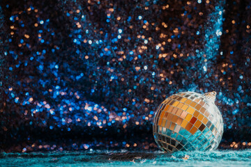 disco ball on sequin and knit background