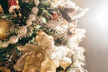 Decorated Christmas tree with flowers, beads, baubles.