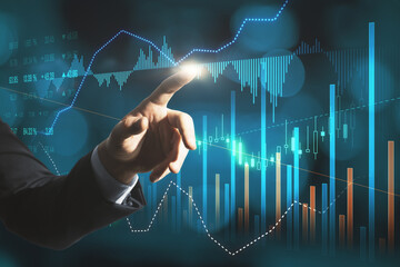 Close up of businessman hand pointing at creative glowing forex graph on blurry bokeh background. Market analysis and trade concept. Double exposure.