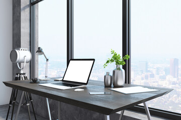 Creative modern designer desktop with empty white laptop, lamp, coffee cup and panoramic city view in the background. Mock up, 3D Rendering.