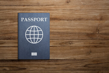 passport on wooden background citizenship by investment