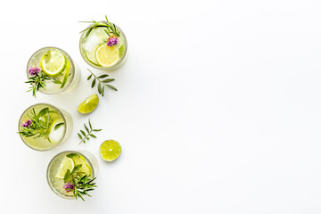 Homemade herbal soda drink with lemon slices and herbs
