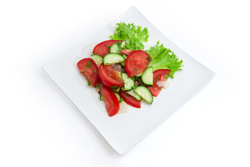 Vegetable salad with fresh sliced tomatoes and cucumbers