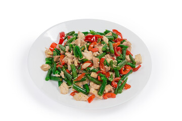 Salad with boiled chicken and vegetables on the white dish