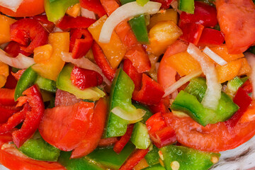 Salad with tomatoes and bell peppers, top view close-up