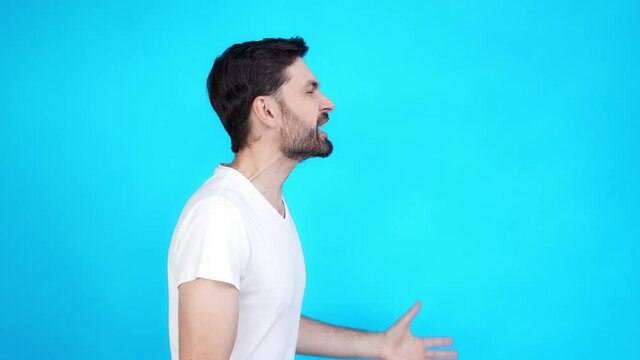 Carefree guy yell empty space bargain isolated on blue color background