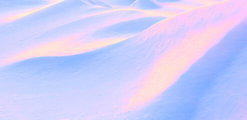 Abstract surreal image in neon pink, blue and golden colors undulating slopes of snow drifts.