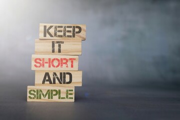 Wooden cubes with text KEEP IT SHORT AND SIMPLE
